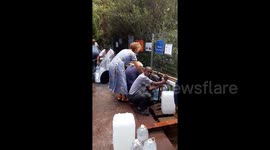 Cape Town families continue to collect water during the drought