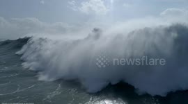 SHOWS END CREDITS: Spectacular drone footage captures surf and jetski wipeout in Portugal