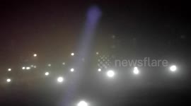 Man uses torch to show off incredibly thick air pollution in Bosnian town