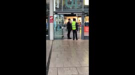 Train conductor helping customer