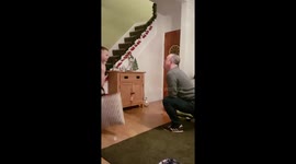 Dad and lad are play fighting and lad cops him with a good one