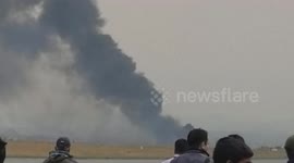 Smoke billows from passenger plane following Kathmandu crash