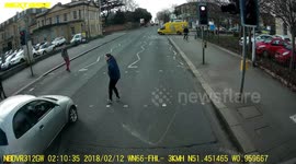That was close! Driver narrowly misses pedestrian after running red light