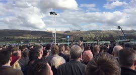 Race-goers watch the action as Cheltenham Festival gets underway