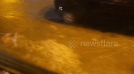 Bus becomes a boat as it drives through flooded streets in Greece