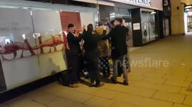 CHELTENHAM FANS PARTYING WITH A BUSKER