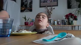 Tired little boy can't stay awake to eat his dinner