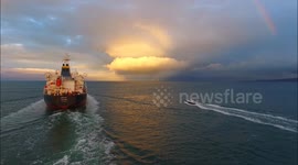 Drone films tanker ship sailing into dramatic Northern Ireland sunset