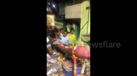 Devotees take giant phallus in procession in India