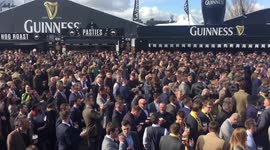 Racegoers pack out the Guinness Village at the Cheltenham Festival