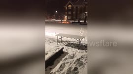 Hilarious moment college student bodyslams table in heavy snow