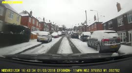 Car Accident in the snow, Car hits wall.