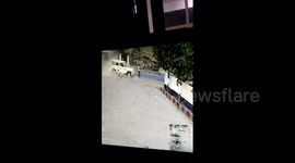 Motorcyclist springs back onto feet after being slammed by jeep