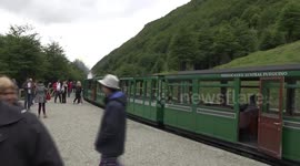 Train of the End of the World - passengers on platform