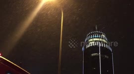 Late night horizontal snow falls in Vauxhall in London