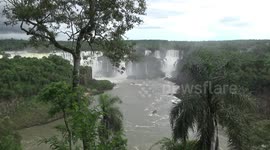 Iguazu Falls with tourists in zodiacs