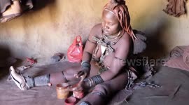 Himba woman shows the Unique & Traditional Skincare in Opuwo, Kaokaland - Namibia