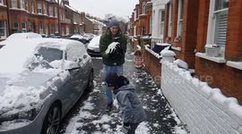 Snow ball falling on head in slow motion