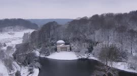 Drone video of world-famous Stourhead gardens enveloped in snow