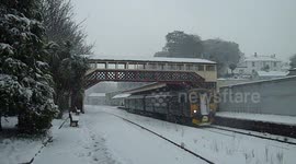 Train Departs Torre Station In Heavy Snowfall