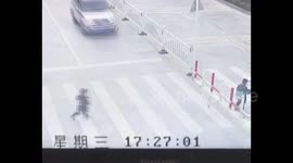 SUV runs over child playing on pedestrian crossing