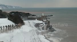 Rare snowfall blankets clifftops of English coastal town of Sidmouth