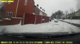 Car Accident in the snow, Car hits wall.