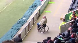 Video shows moment fan jumps out of wheelchair at football match