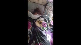 Brother tips bucket of snow over sister while she's in bed