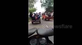 Tractor carrying 25 passengers topples over in dangerous overtake