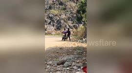 Newsflare Edit - Two children riding motorcycles in mountainous Vietnam