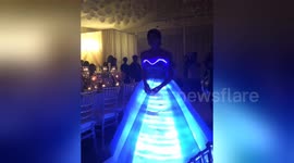 Actress dazzles birthday guests with light-up dress