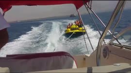 People are floating on tube and falls