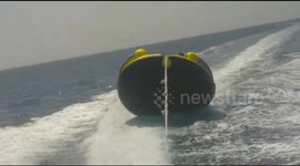 People are floating on tubes