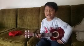 a boy singing expressed happiness