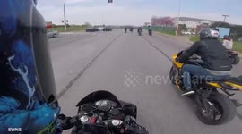 Moment motorcyclist is thrown 10ft into the air after failed wheelie