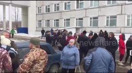 Protest outside hospital after up to 57 pupils poisoned