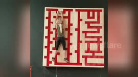 Woman takes on maze trainer in intense workout