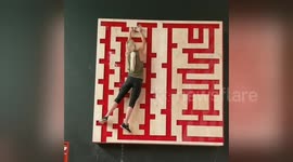 Woman takes on maze trainer in intense upper-body workout