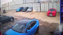 Shocking footage shows the moment a man lost control of a quad bike and ploughed into the side of his £50,000 sports car