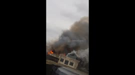 Fire rages on a rooftop of 4 storey building in Glasgow