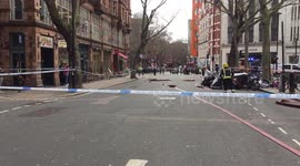 Police with dogs and firemen near New Oxford Street in London