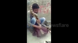 Terrifying moment python chokes snake charmer during live act