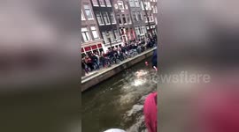 England fans swim in Amsterdam canal ahead of match