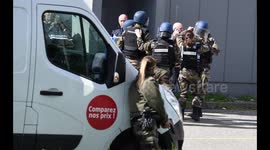 Photographer’s images capture police raid during hostage situation in France