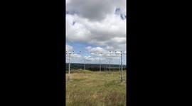 Low flying airplane landing sideways in strong winds