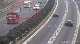 Woman stands in the middle of motorway trying to get free ride