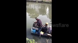 Villager catches one-meter-long crocodile on riverbank