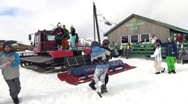 Skiers highland dancing on mountain during ceilidh at Glenshee Ski Centre, Scotland