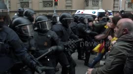 Riot police clash with demonstrators in Barcelona after leader is held